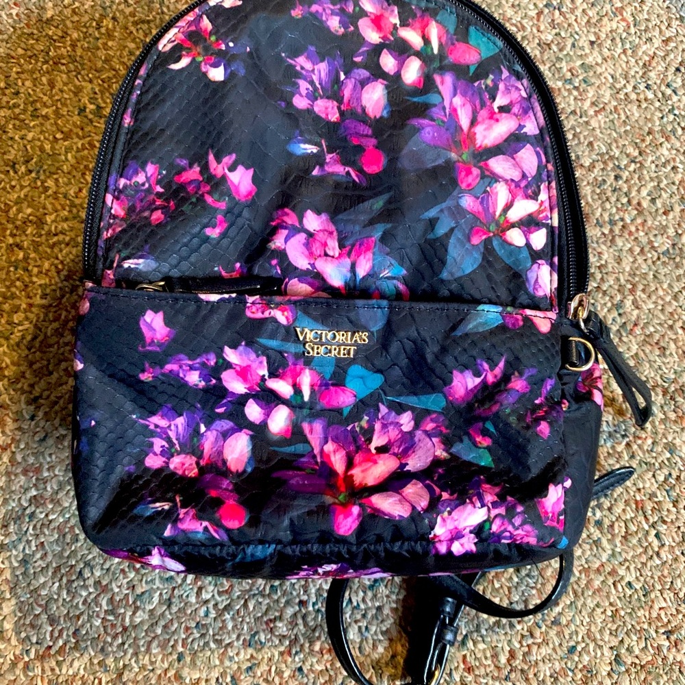 A pink and purple floral pattern Victoria’s Secret backpack